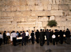Mourners in front a wall in israel